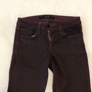 Maroon denim pants.